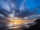 Sunset sky reflected on water on beach. Whidbey Island, Washington State. Art Print